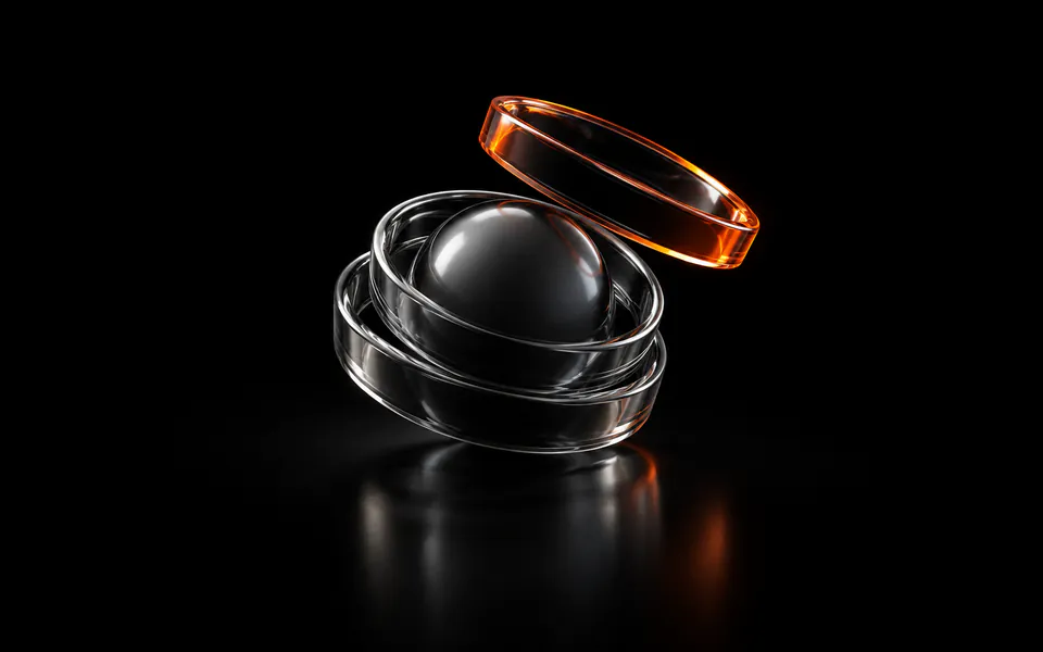 Three nested glass wrapper rings surround a core, with the lifted outer ring glowing orange